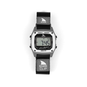 Digital watch with shark-themed strap on a white background