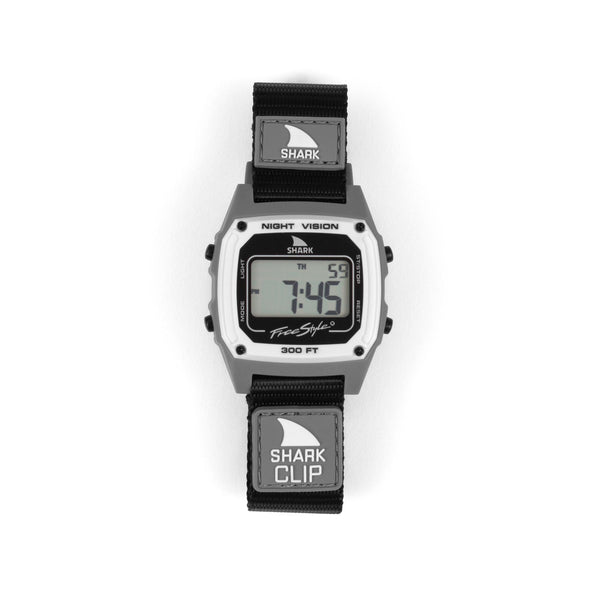 Digital watch with shark-themed strap on a white background