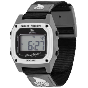 Digital watch with black strap and gray case on a white background