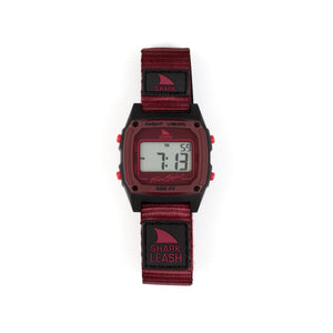 Digital watch with a red strap on a white background