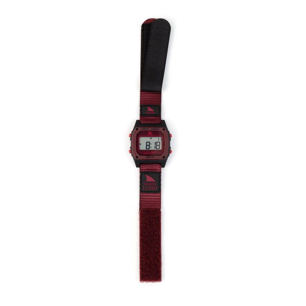 Digital watch with a red strap on a white background