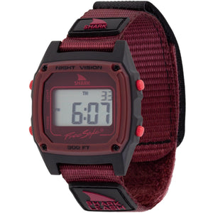 Digital watch with red strap and black case on a white background