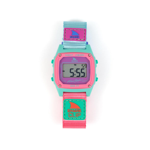 Digital watch with pink and teal strap on a white background