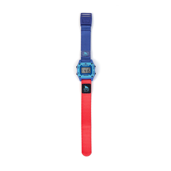 Digital watch with a blue and red strap on a white background