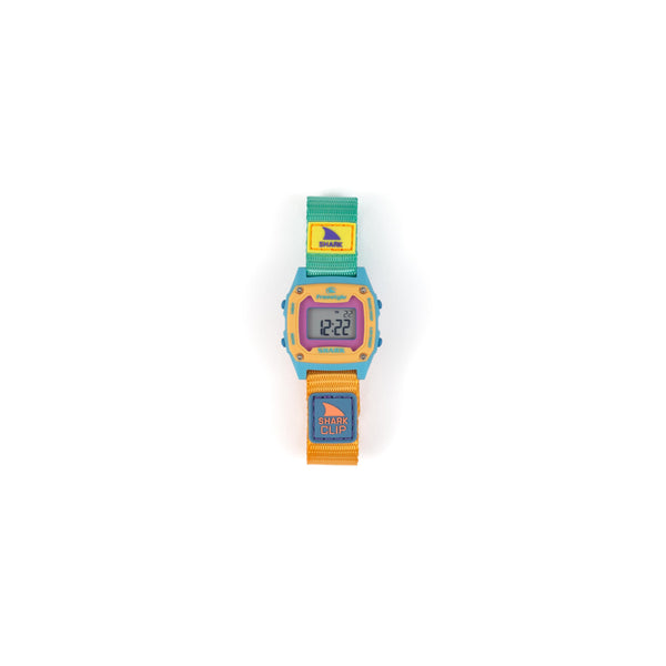 Colorful digital watch with a shark-themed strap on a white background