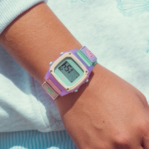 The Freestyle SHARK CLASSIC CLIP MELON MIX watch is worn on a wrist with a light long-sleeve shirt.