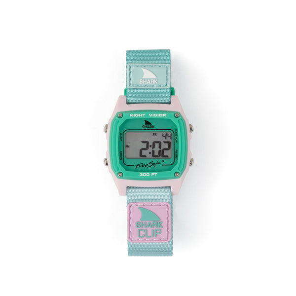 Freestyle Shark Classic Clip Pure Aqua watch with a mint green face, light blue strap, and a digital display with night vision backlight.