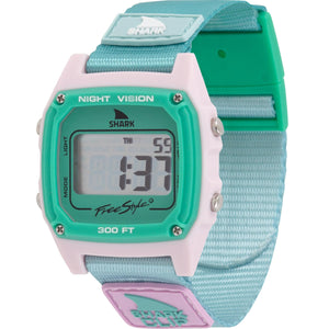 The Freestyle SHARK CLASSIC CLIP PURE AQUA watch features a teal & white design, nylon strap, and displays numbers on its digital screen.