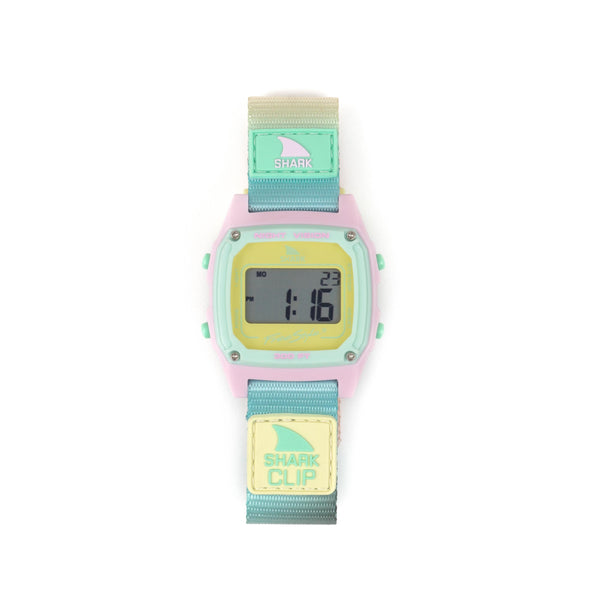 Shark Classic Clip Scenic Sky digital watch with pastel pink case, soft yellow face, and ombré strap.