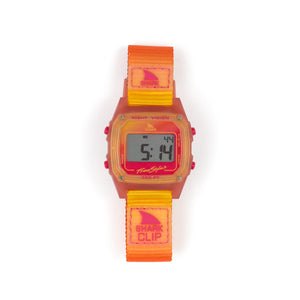 The Freestyle SHARK CLASSIC CLIP SUNSET features an orange-yellow strap and 300ft water resistance.