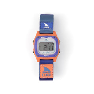 Freestyle SHARK CLASSIC LEASH SHORE BREAK with orange case, purple details, blue strap, and water-resistant design.