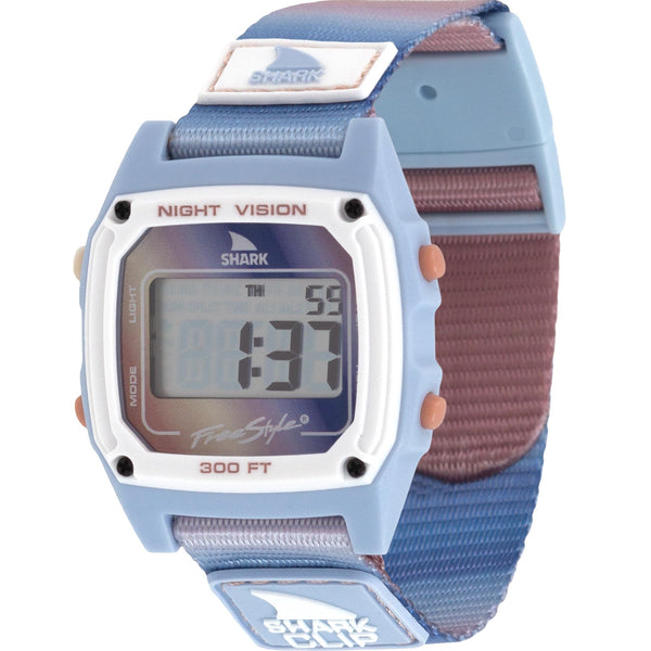 Freestyle Shark Clip watch with a soft blue-to-mauve gradient strap, night vision display, and 300 FT water resistance.