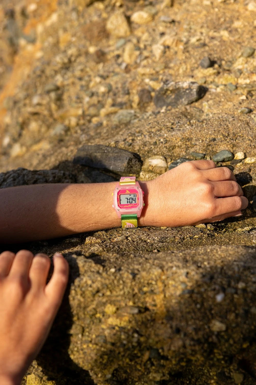 Surfer Girl watch resting on a rock