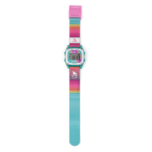 The Freestyle SHARK CLASSIC CLIP PINK HORIZON watch features a rainbow strap, turquoise case, and a pink buckle.