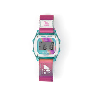 The Freestyle SHARK CLASSIC CLIP PINK HORIZON watch features a pink/teal strap, white face, and a backlight for visibility in low light.