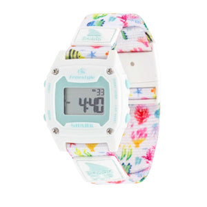 Freestyle SHARK MINI CLIP REEF LIFE: White digital watch with pastel floral band and aqua accents, display illuminated.
