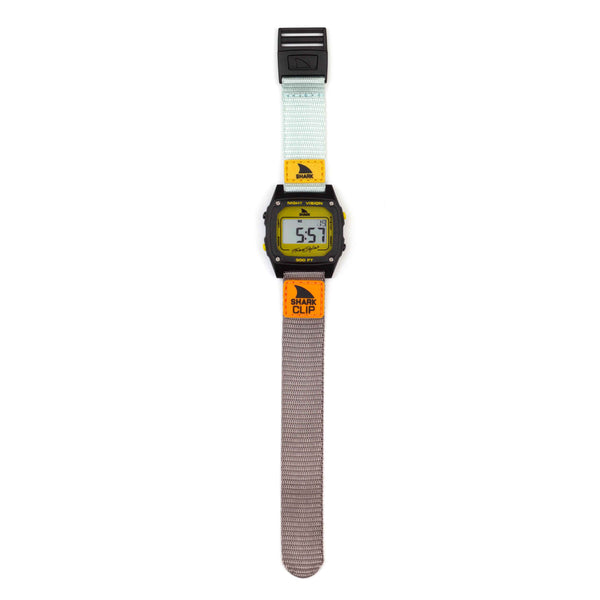 Freestyle SHARK CLASSIC CLIP TURQ/BLK/MUSTARD digital watch with a gray strap and yellow face, on white background.