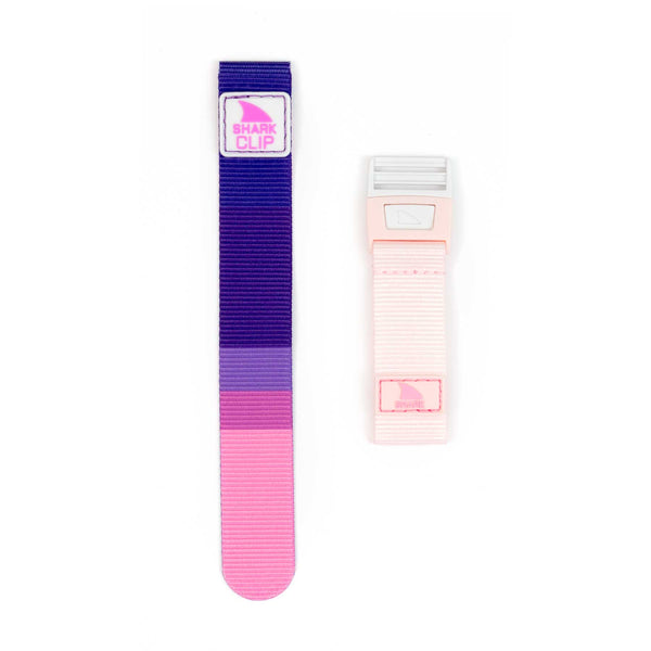 Two watch bands: a Shark Classic - Strap Kit - Clip in Pink Lemonade by Freestyle and a smaller light pink with rectangular buckle.