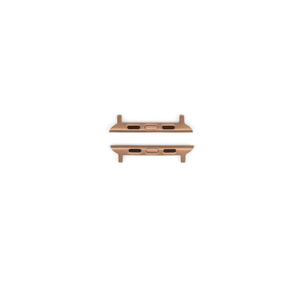 Two Freestyle APPLE WATCH™ ADAPTER 44/45/46/49MM in rose gold with steel connectors on a white background.