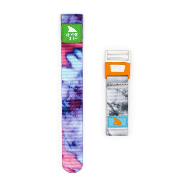 Two Freestyle Apple Watch™ Clip Straps—one in tie dye magenta/blue, another in gray-white with orange clip.