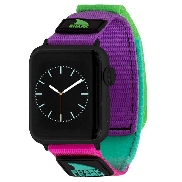 APPLE WATCH™ LEASH STRAP MASQUERADE by Freestyle: A colorful strap featuring shades of purple, green, and pink with an analog watch face.