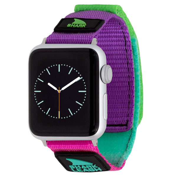 APPLE WATCH™ with a vibrant Freestyle LEASH STRAP MASQUERADE, showcasing an analog watch face.