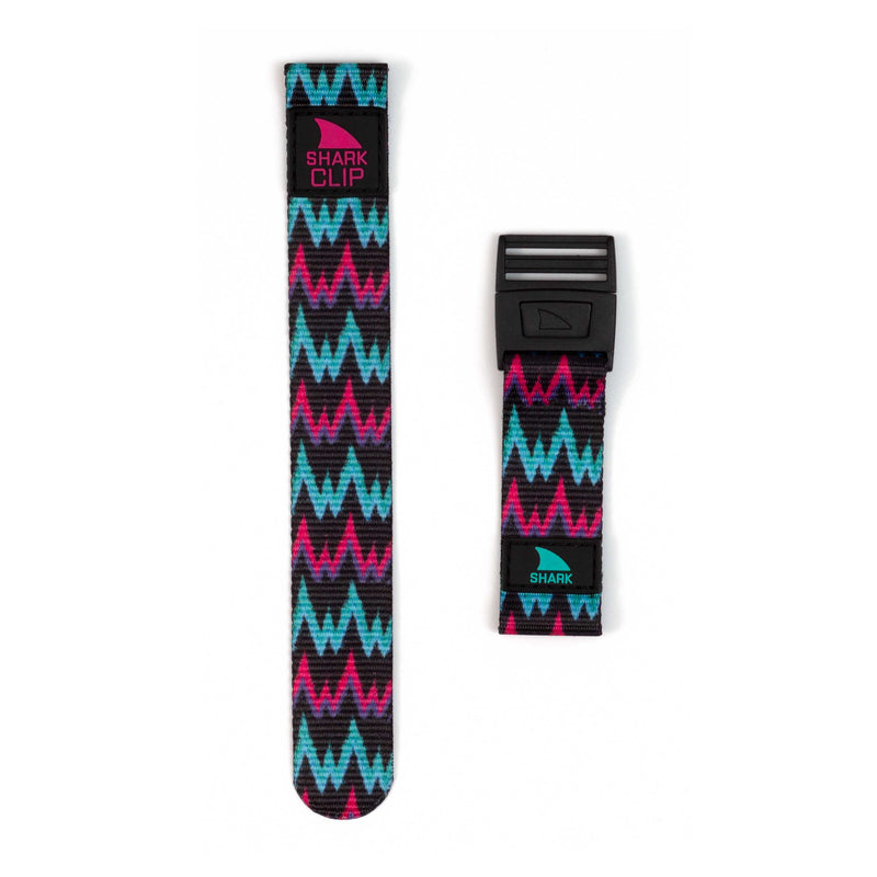 Two pieces of the Freestyle STRAP KIT - CLIP - RADIOACTIVE watch strap in blue and pink zigzag, labeled SHARK CLIP.