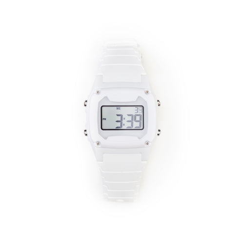 The Freestyle SHARK CLASSIC WHITE OUT watch displays numbers and characters on its screen with a silicone band.