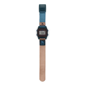 Retro-futurism shines in the Freestyle SHARK CLASSIC CLIP SEA N SAND watch with Shark Clip text and a blue-tan strap, blending bold style and unique design.