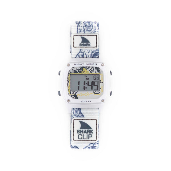 Retro-futurism shines in the Freestyle SHARK CLASSIC CLIP OCTOPUS watch with a white and blue band, displaying a digital screen.