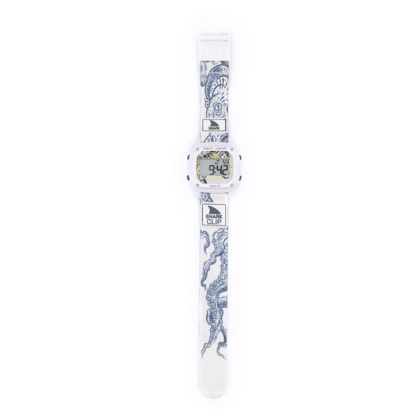 Inspired by retro-futurism, the Freestyle SHARK CLASSIC CLIP OCTOPUS features a digital watch face with a white band and blue octopus art.