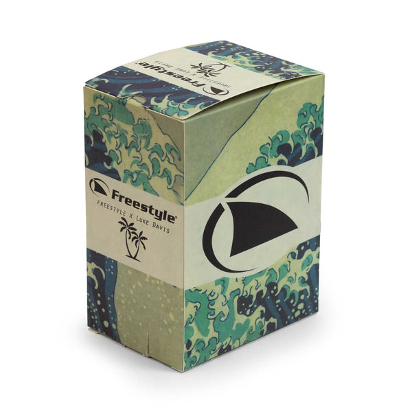 Wave-patterned box featuring the Freestyle logo, the word Freestyle, and a palm tree icon for the Luke Davis Signature Shark Classic Clip watch.