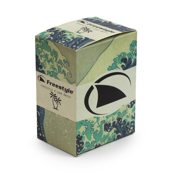 Box featuring a wave design, Freestyle logo, palm tree illustration, abstract patterns, and the Luke Davis Signature Shark Classic Clip in Luke the Grey.