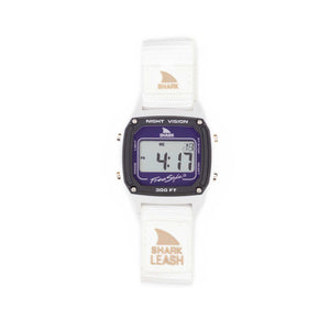 Freestyle SHARK CLASSIC LEASH WHITE DOLPHIN watch with white band, purple face, water resistant, digital display active.