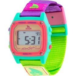 Freestyle SHARK CLASSIC CLIP SOUR APPLE digital watch featuring a teal, pink, and purple face and a green-purple fabric strap.