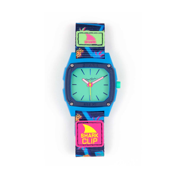 Freestyle SHARK CLASSIC CLIP ANALOG MALIBLU watch featuring a blue clock face, multicolored strap, and bold SHARK CLIP labels.