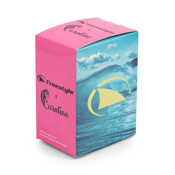 The product box, featuring a vibrant pink and blue ocean wave design, represents the Clear Blue Sky Caroline Marks Signature Shark Classic Leash. It prominently showcases the Freestyle brand name and stylized logo against a bright, clean background with a partially visible website URL at the bottom.