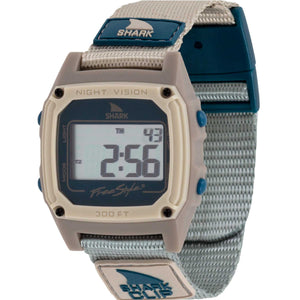 The Freestyle SHARK CLASSIC CLIP COOL SHORE pairs retro style with a beige/teal case and fabric strap, display screen visible.