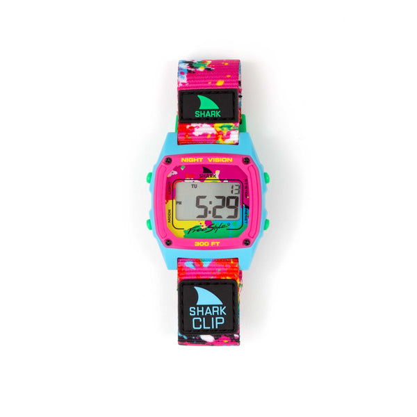 Freestyle SHARK CLASSIC CLIP NEON SPLATTER watch with pink, teal, and black strap and SHARK CLIP label on the band.