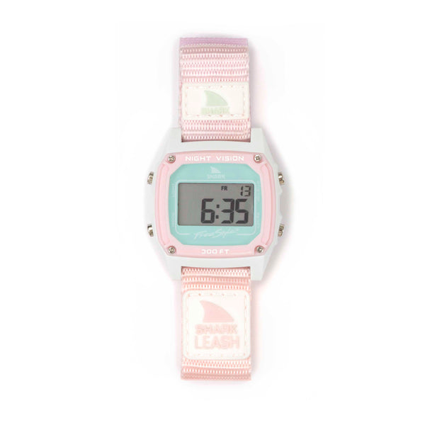 The Freestyle SHARK CLASSIC LEASH BASHFUL displays numbers and letters on its screen and features a pink and white strap with digital functions.