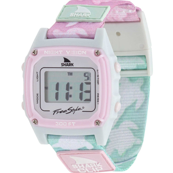 Freestyle SHARK CLASSIC CLIP TWO TONE TURTLE digital wristwatch featuring a pastel pink and green camouflage band. The display shows 11:13, and the watch includes Night Vision technology along with the iconic Shark Clip. Inspired by retro-futurism.