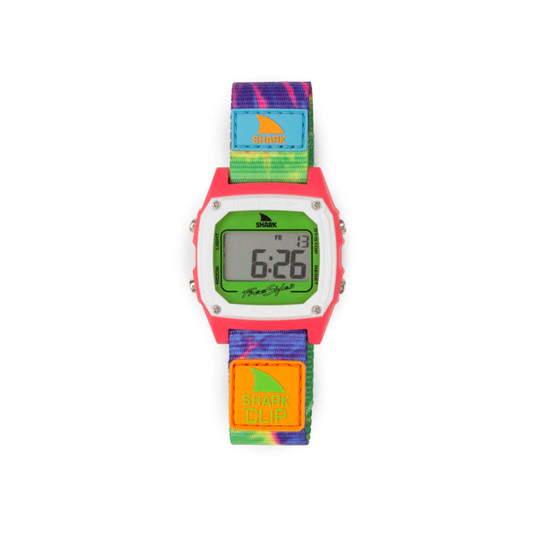 The SHARK CLASSIC CLIP TIE DYE GREEN NEON watch from Freestyle features a red bezel, displays 6:26, and has a vibrant rainbow strap.