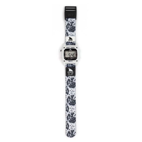 Freestyle SHARK CLASSIC CLIP BULLSEYE watch with black-and-white strap, retro-futurist style, shown flat with digital display visible.