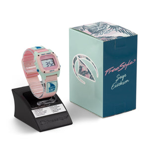 Freestyle SAGE ERICKSON SIGNATURE SHARK CLASSIC CLIP BLUE SAGE PINK watch displayed beside a palm leaf box.