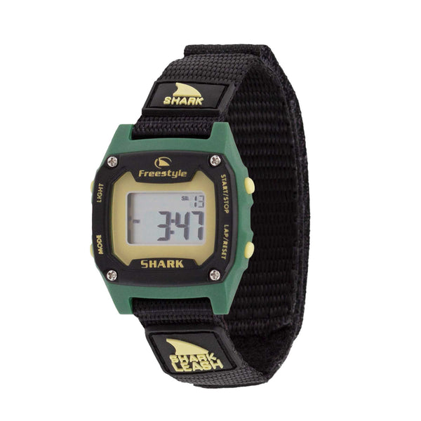 The SHARK MINI LEASH RANGER digital watch by Freestyle features a black band and green bezel with a shark logo, displaying the time 3:47. Water resistant.